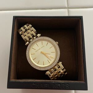 Michael Kors women’s gold and diamond watch